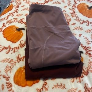 2 pack leggings both size medium red and mauve